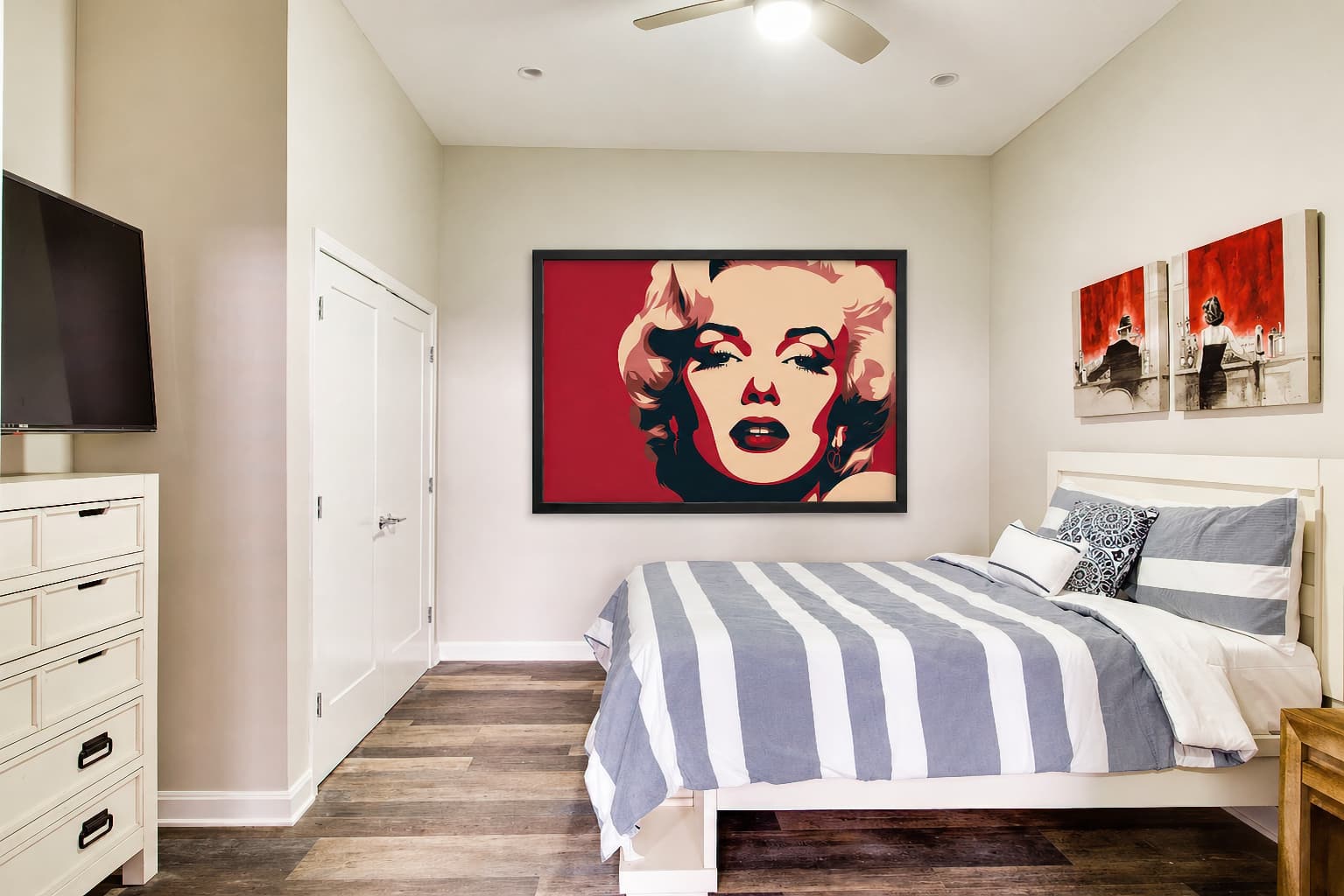Theatre District Condo bedroom with pop art decor and a wall-mounted TV in Louisville, Kentucky