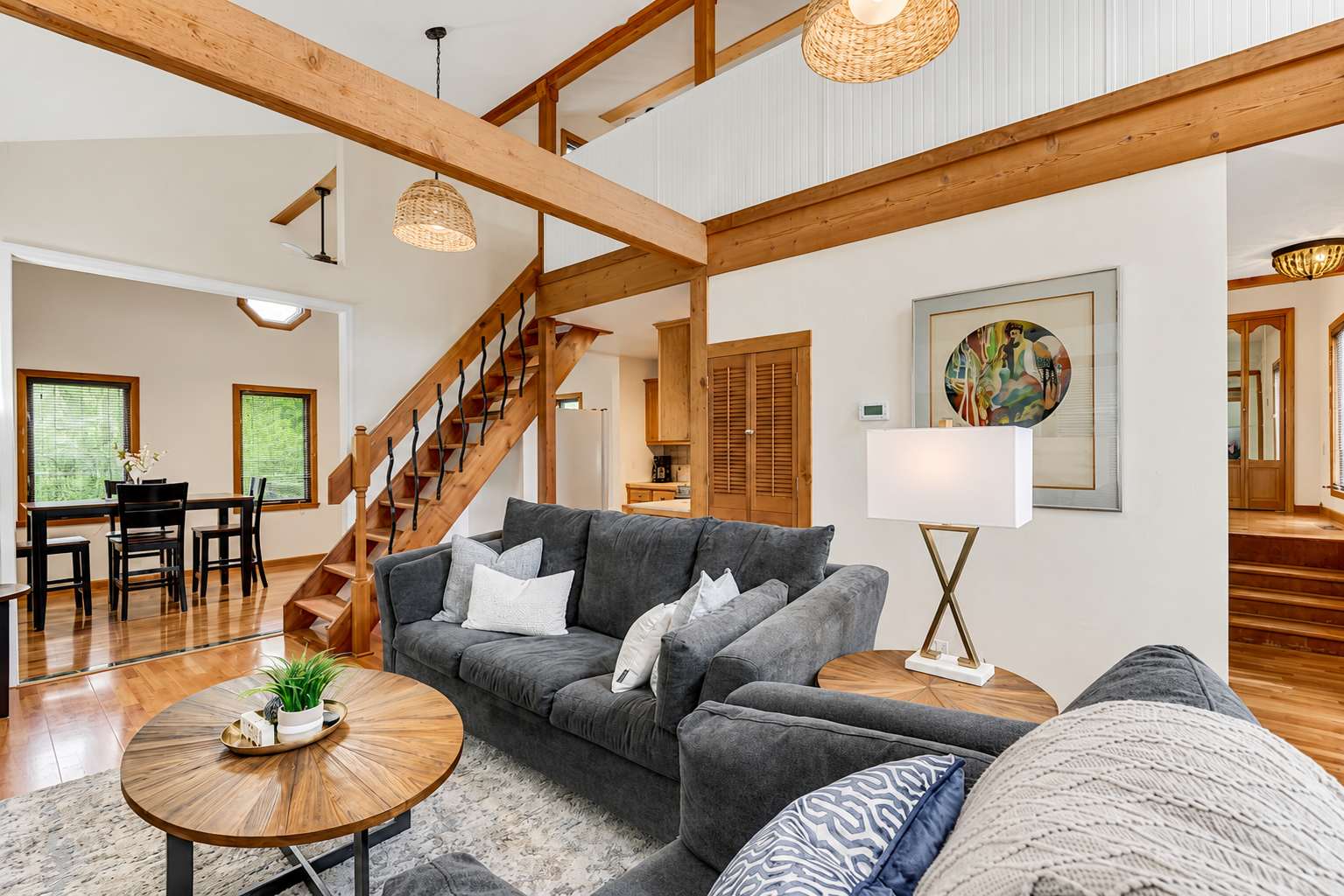 Gorgeous Riverfront Loft with exposed beams, a loft staircase and vaulted living room in Indianapolis, Indiana