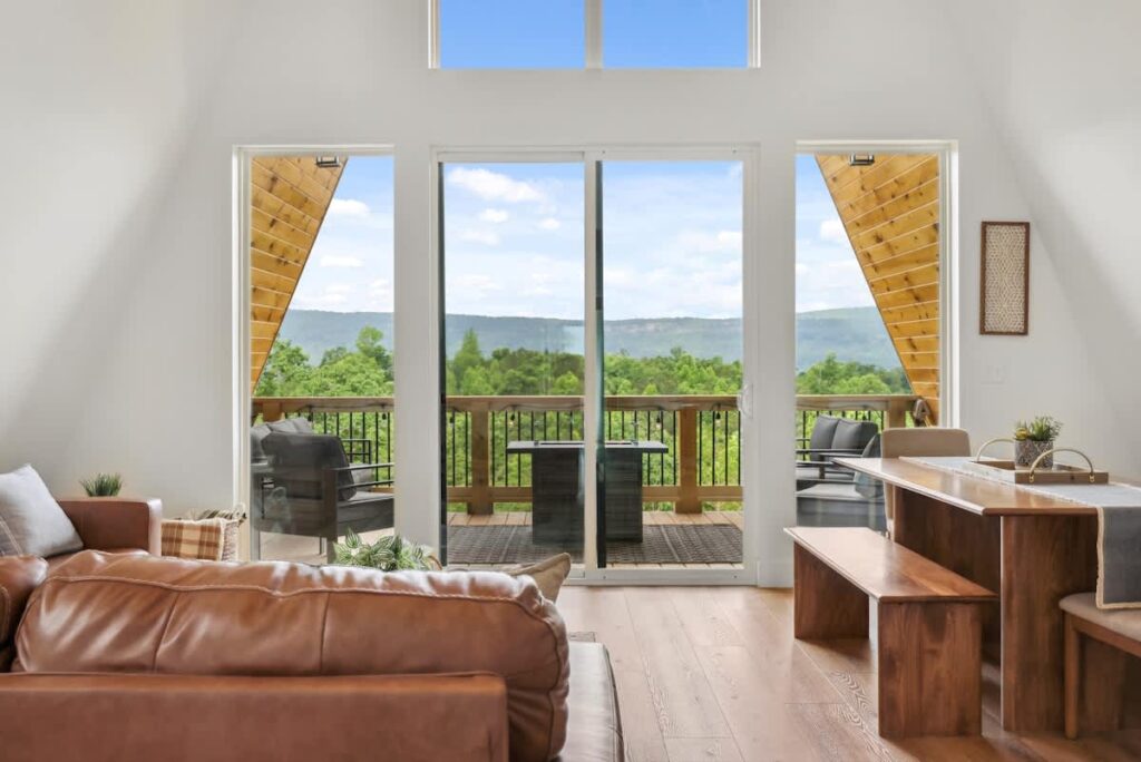 Nordic Nest, an A-frame living room opening to a deck above the valley in Rossville, Georgia