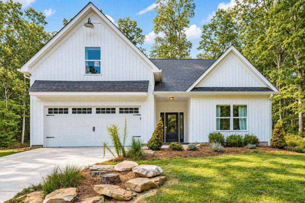 Cloudland Summit, a white farmhouse with a two-car garage and front lawn in Rising Fawn, Georgia